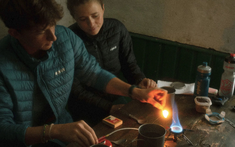 Bikepackers cooking a meal