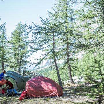 Wild camping by a lake in the mountains