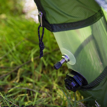 Wild camping by a lake in the mountains