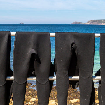 Putting on an outdoor swimming wetsuit