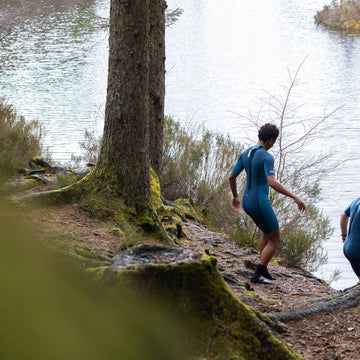 Putting on an outdoor swimming wetsuit