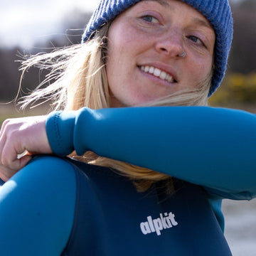 Putting on an outdoor swimming wetsuit