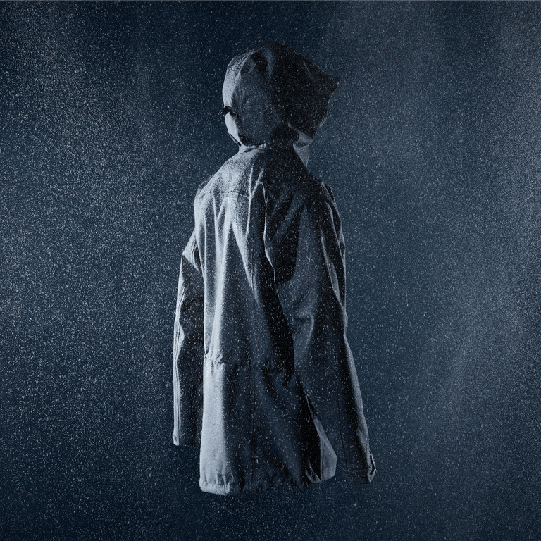 Shot of the Alpkit Fortitude Waterproof Jacket in a rainy studio